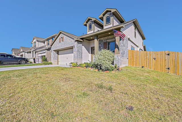 view of front of house featuring a front yard and a garage