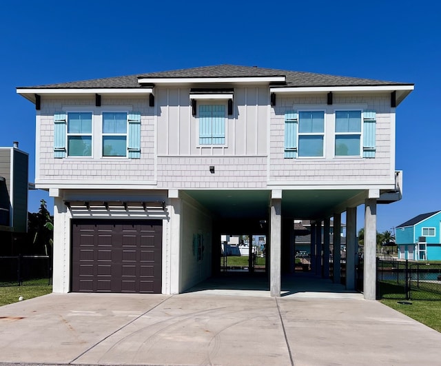 view of front of home featuring a garage and a carport