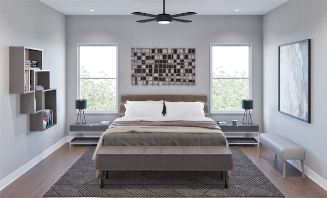 bedroom featuring ceiling fan and dark wood-type flooring