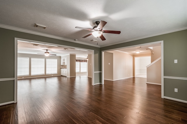 spare room with ornamental molding, a textured ceiling, ceiling fan, and dark hardwood / wood-style flooring