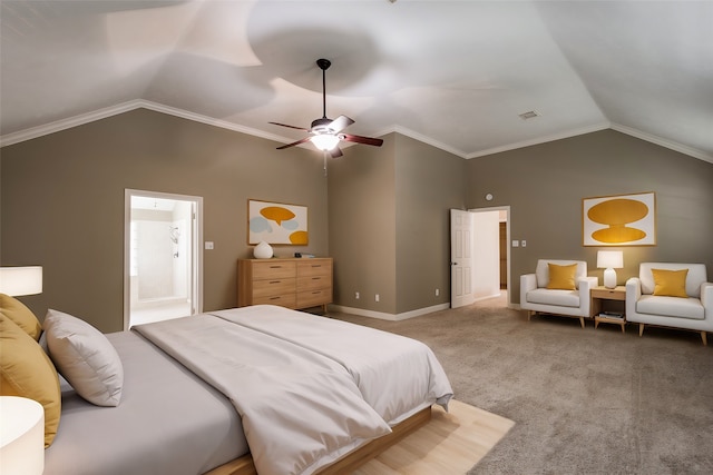 carpeted bedroom with ornamental molding, vaulted ceiling, ceiling fan, and ensuite bath