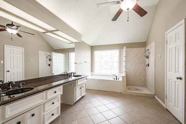 bathroom featuring vaulted ceiling, vanity, ceiling fan, and plus walk in shower