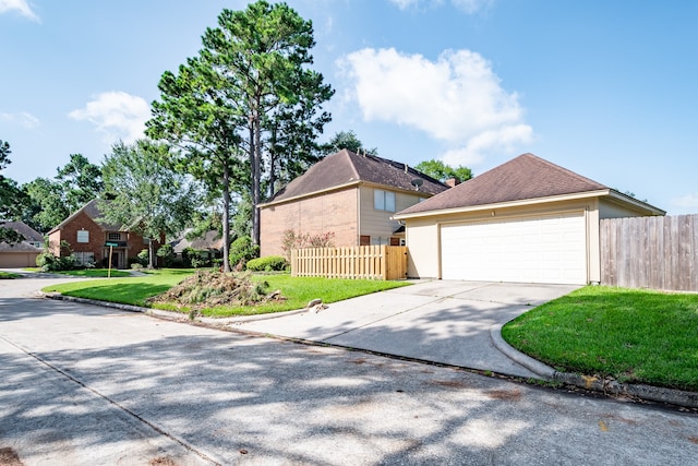 view of front property with a garage and a front yard