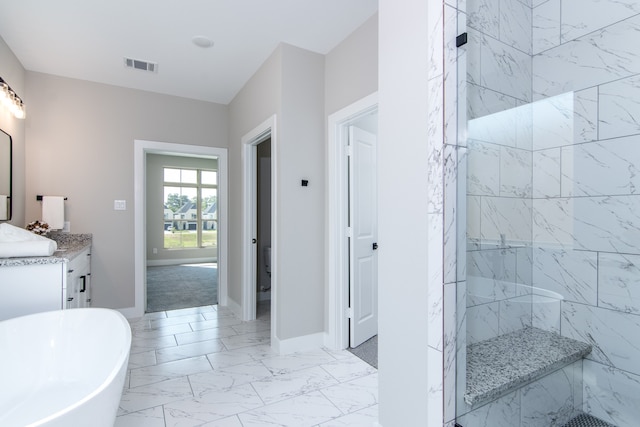 bathroom featuring plus walk in shower and vanity