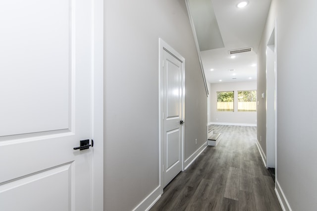 corridor featuring dark wood-type flooring