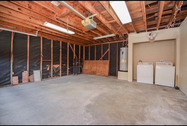 interior space with water heater, washing machine and dryer, and a garage door opener