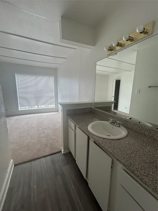 bathroom with vanity and hardwood / wood-style floors