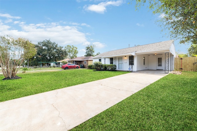 ranch-style home featuring a front yard