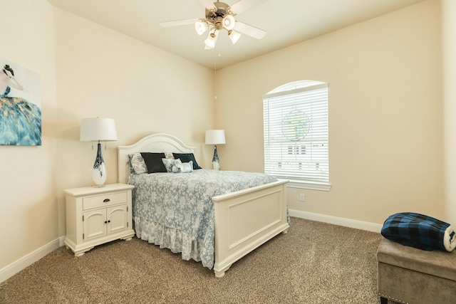 bedroom featuring ceiling fan and carpet