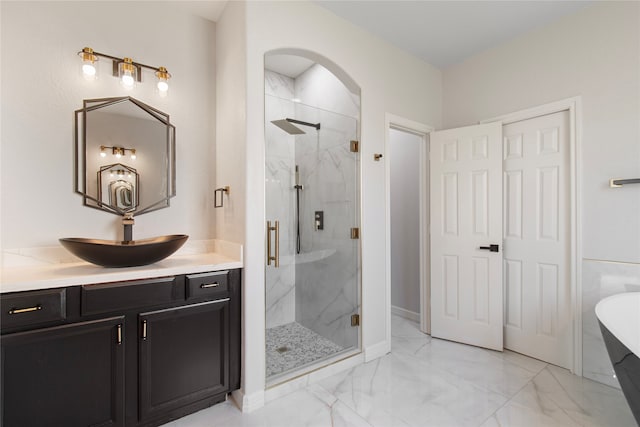 bathroom featuring vanity and separate shower and tub