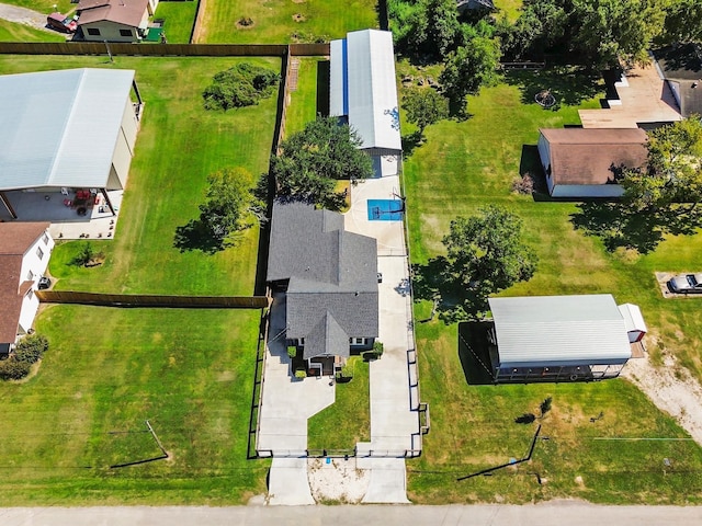 birds eye view of property with a residential view