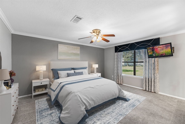 carpeted bedroom with ceiling fan, ornamental molding, and a textured ceiling