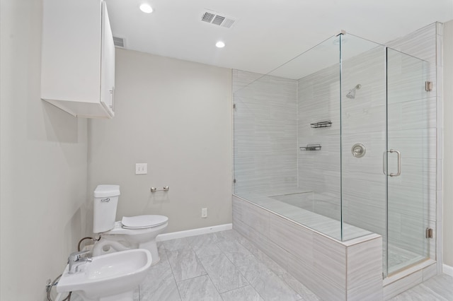 bathroom with toilet, sink, a bidet, and an enclosed shower