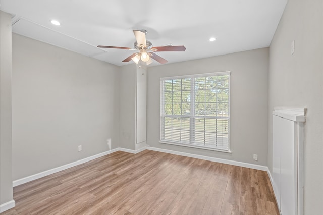 unfurnished room featuring light wood-type flooring and ceiling fan