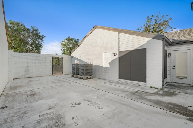 view of home's exterior with a patio and central air condition unit