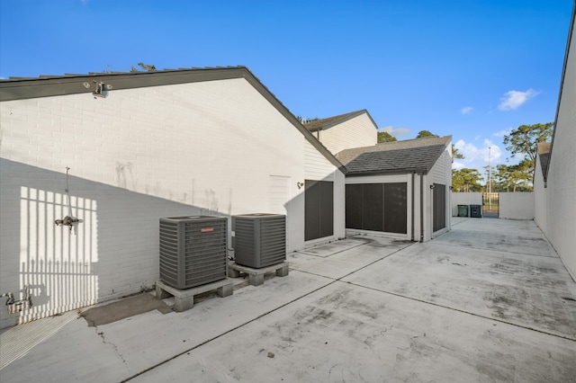 view of property exterior with a patio and cooling unit