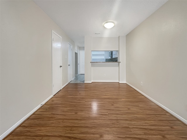 hall with wood-type flooring