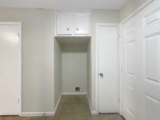 laundry room with light tile patterned floors