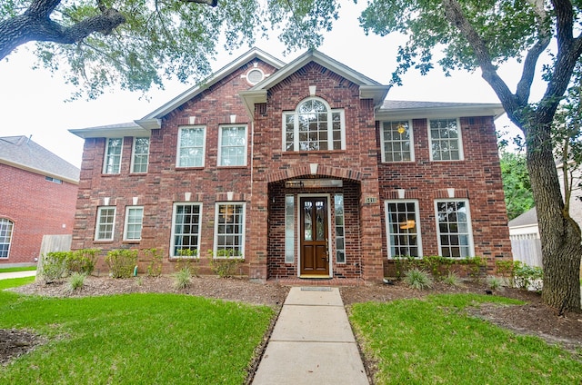 view of front of home with a front lawn