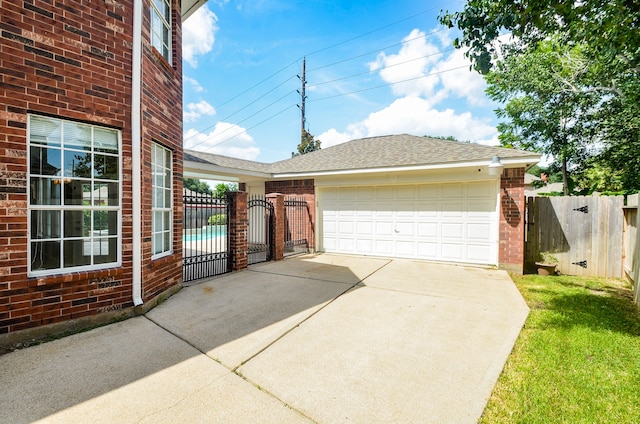 garage featuring a lawn