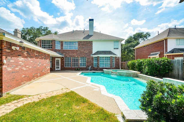 view of pool featuring an in ground hot tub and a patio area