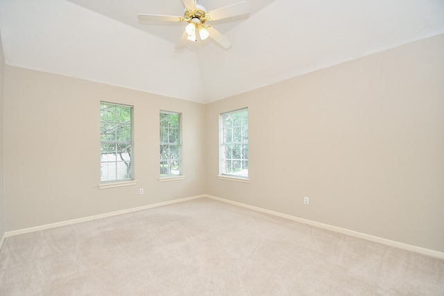 unfurnished room with light carpet, lofted ceiling, and ceiling fan