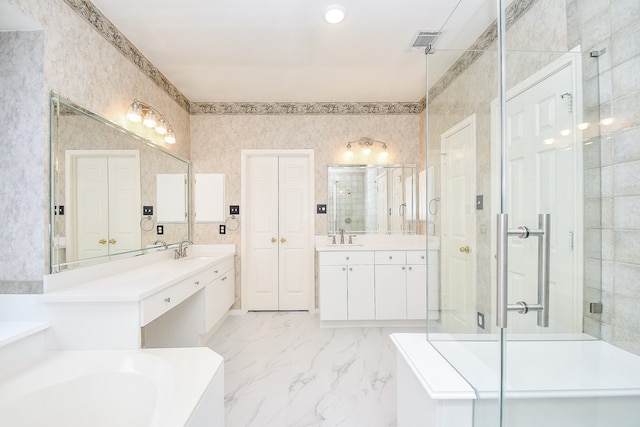 bathroom featuring vanity and independent shower and bath