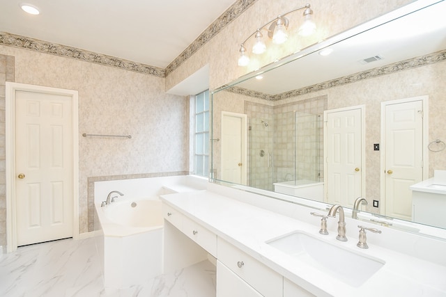 bathroom featuring vanity and shower with separate bathtub