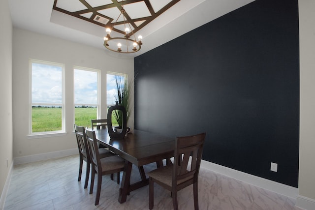 dining space with an inviting chandelier