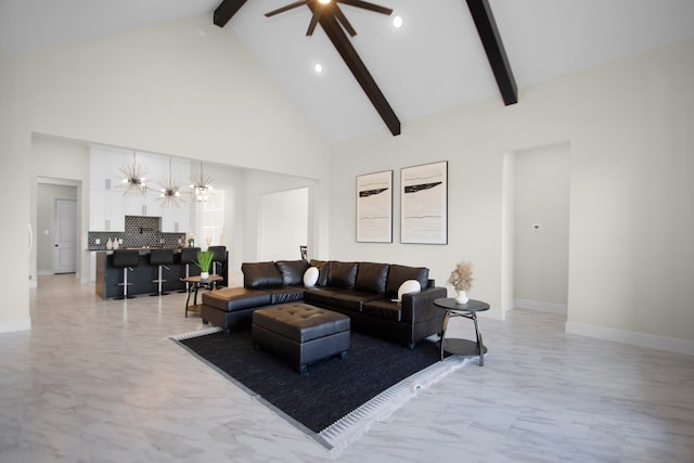 living room with beamed ceiling, a chandelier, and high vaulted ceiling