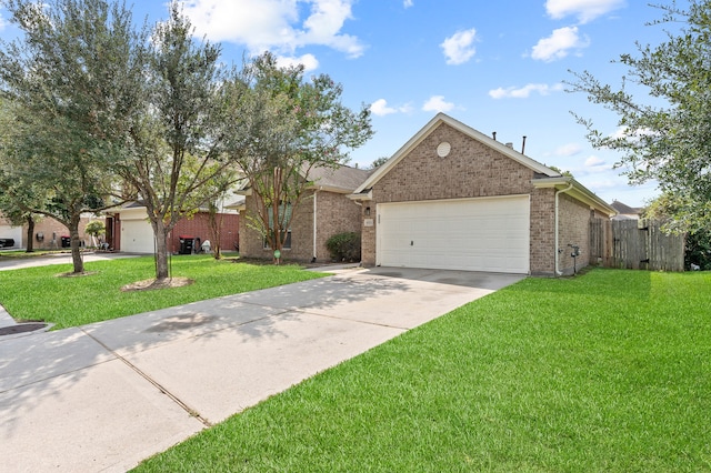 ranch-style house featuring a front yard and a garage