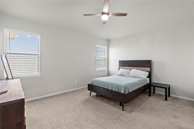 bedroom with light carpet and ceiling fan