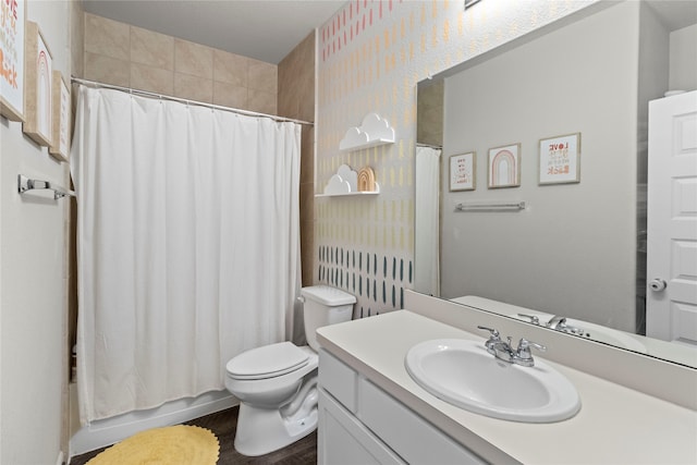 bathroom with wood-type flooring, a shower with curtain, vanity, and toilet