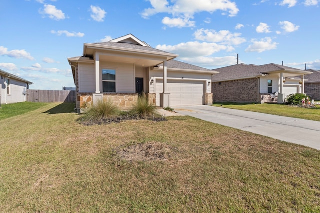 ranch-style home featuring a garage and a front lawn