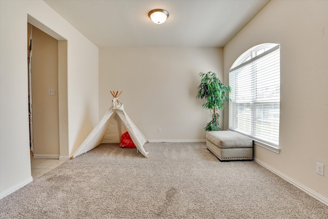 rec room with light carpet