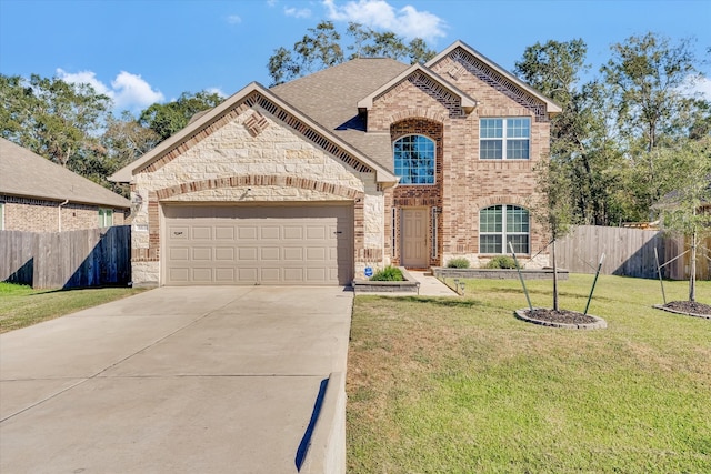 view of front of house with a garage and a front lawn