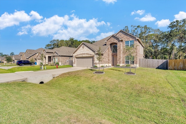 view of front facade featuring a front yard and a garage