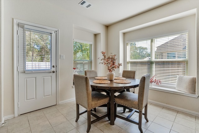 dining space with light tile patterned floors