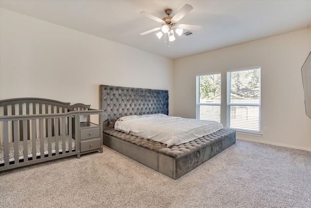 carpeted bedroom with ceiling fan