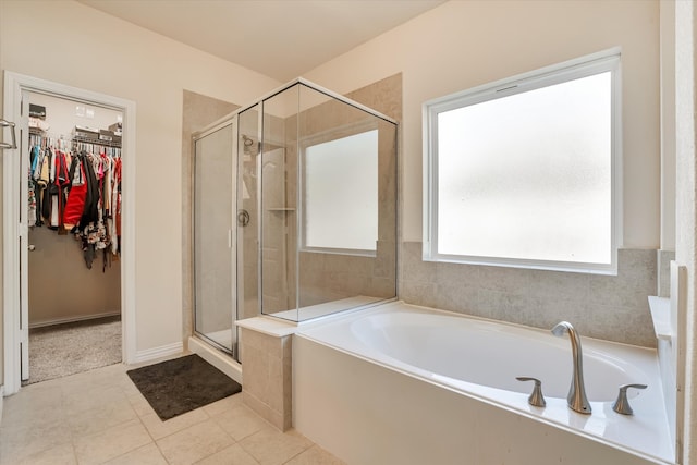 bathroom featuring independent shower and bath and tile patterned floors