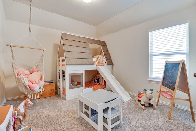 recreation room with light colored carpet and a wealth of natural light