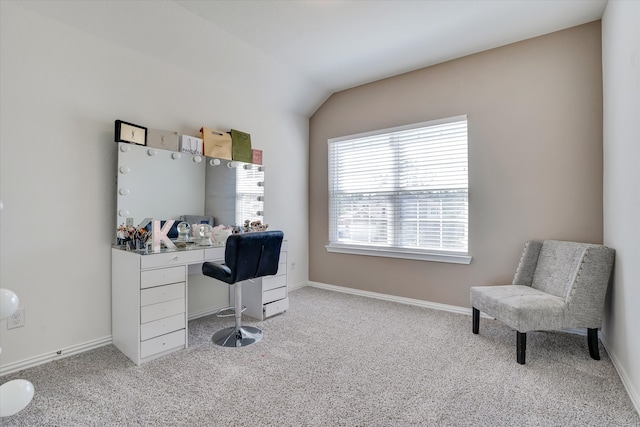 office space featuring vaulted ceiling and light colored carpet