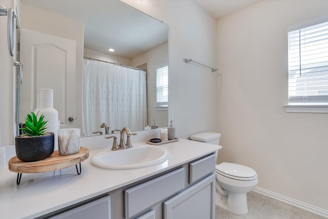 bathroom featuring a shower with shower curtain, tile patterned floors, vanity, and toilet