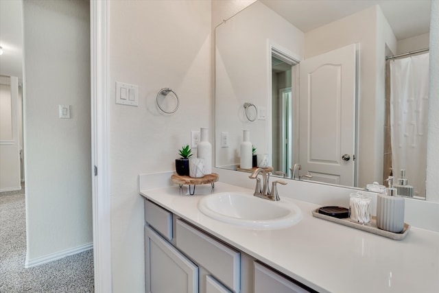 bathroom featuring vanity and curtained shower