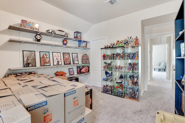 game room featuring light carpet and vaulted ceiling