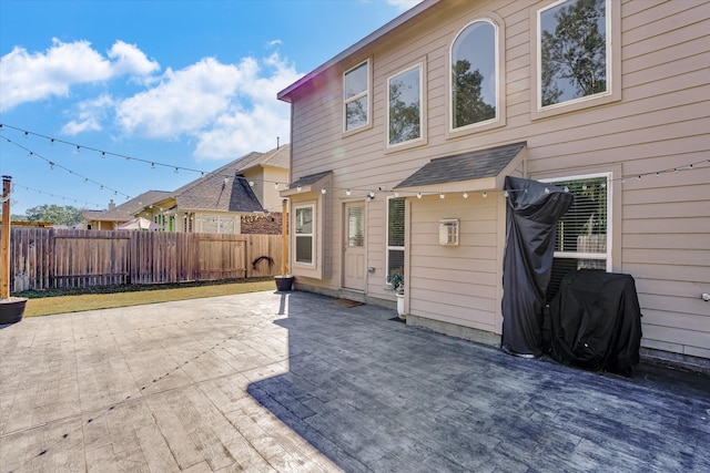 rear view of house featuring a patio