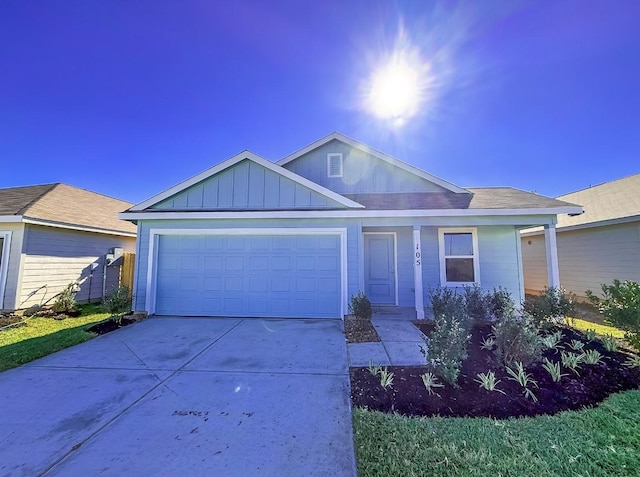 105 Nicholas Rd, Wharton, TX 77488 - ranch-style house featuring an attached garage, driveway, and board and batten siding