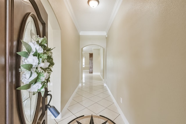 corridor featuring light tile patterned flooring and ornamental molding