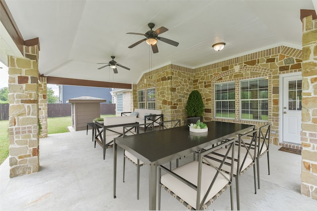 view of patio featuring a storage shed and ceiling fan