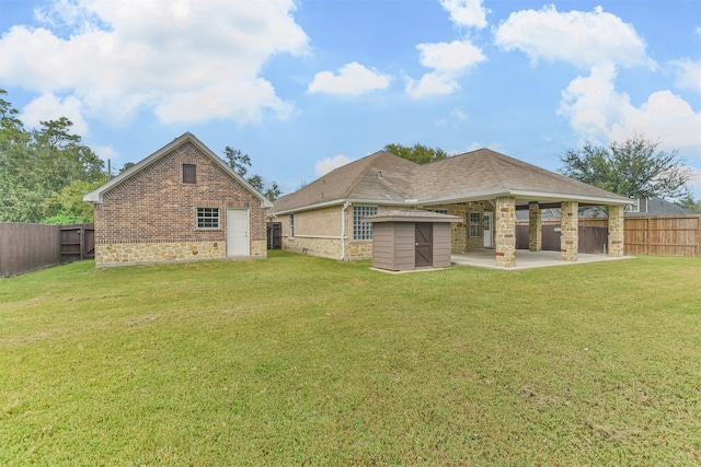 back of property featuring a yard and a patio area